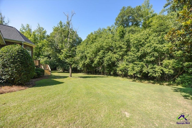 208 W Troon, Macon, GA 31210 - view of green lawn featuring a wooden deck