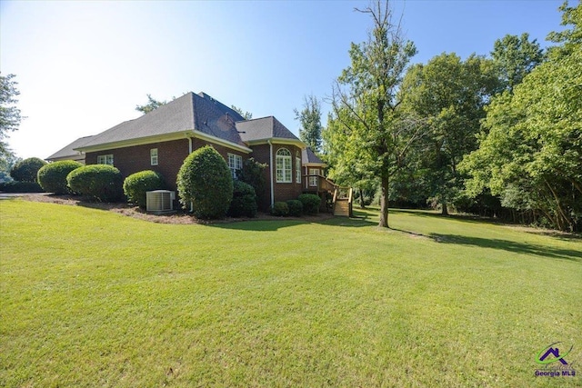 208 W Troon, Macon, GA 31210 - view of side of property with a lawn, a deck, brick siding, and stairs