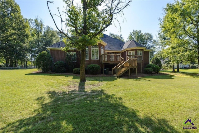 208 W Troon, Macon, GA 31210 - rear view of property featuring stairway, a deck, brick siding, and a lawn