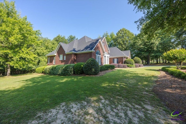 208 W Troon, Macon, GA 31210 - view of side of home featuring a lawn and brick siding