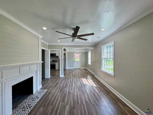 1930 Northbrook Ave, Macon, GA 31204 - unfurnished living room with a ceiling fan, a brick fireplace, dark wood-style floors, crown molding, and recessed lighting