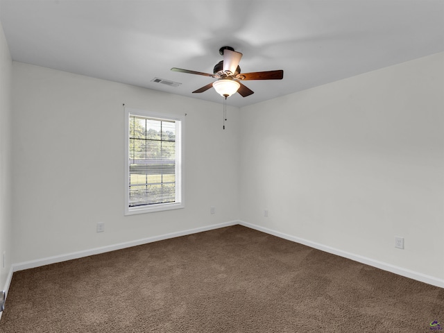 539 Levi Barnes Rd, Jackson, GA 30233 - unfurnished room with a ceiling fan and dark carpet