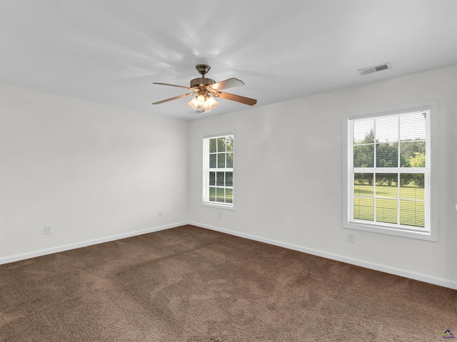 539 Levi Barnes Rd, Jackson, GA 30233 - unfurnished room with plenty of natural light, dark carpet, and a ceiling fan