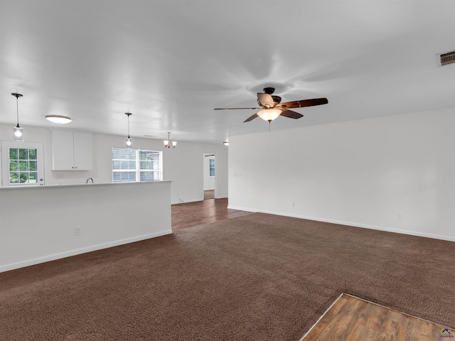 539 Levi Barnes Rd, Jackson, GA 30233 - unfurnished living room with a ceiling fan and dark colored carpet