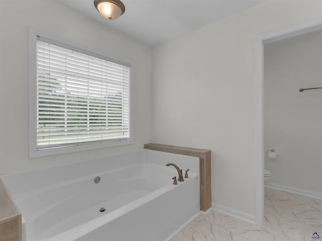 539 Levi Barnes Rd, Jackson, GA 30233 - bathroom featuring a garden tub and marble finish floors
