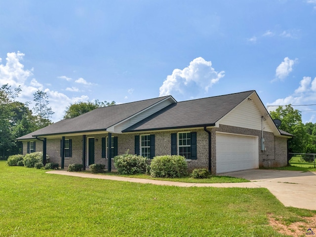 539 Levi Barnes Rd, Jackson, GA 30233 - single story home featuring a garage, driveway, brick siding, and a front yard