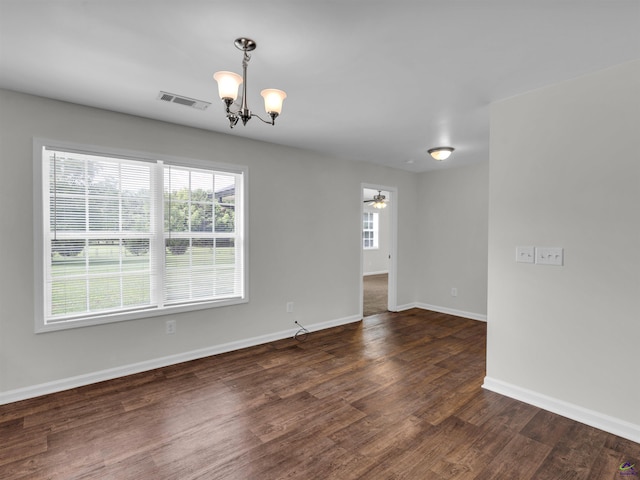 539 Levi Barnes Rd, Jackson, GA 30233 - spare room featuring a chandelier, healthy amount of natural light, dark wood-style floors, and ceiling fan