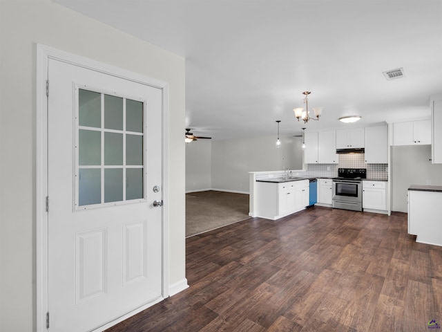 539 Levi Barnes Rd, Jackson, GA 30233 - kitchen with stainless steel range with electric cooktop, a peninsula, a chandelier, white cabinets, and under cabinet range hood