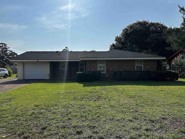 108 Virginia Dr, Warner Robins, GA 31093 - single story home with asphalt driveway, an attached garage, and a front yard