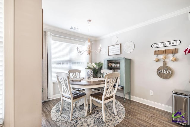 306 Gibson Cir, Kathleen, GA 31047 - dining room with a chandelier, crown molding, and dark wood-type flooring