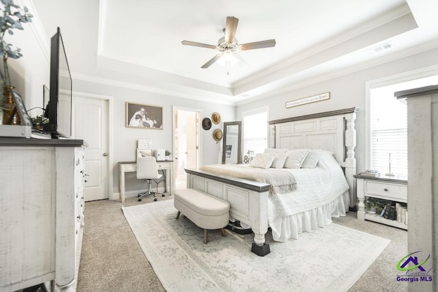 306 Gibson Cir, Kathleen, GA 31047 - bedroom with a tray ceiling, light colored carpet, crown molding, ceiling fan, and a desk