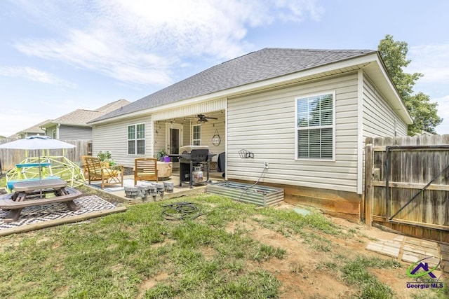 306 Gibson Cir, Kathleen, GA 31047 - rear view of house with a patio, an outdoor living space, a garden, roof with shingles, and a ceiling fan