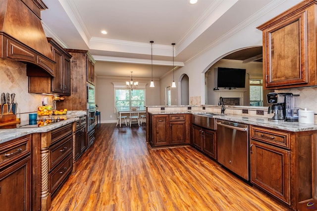 240 Woodlands Blvd, Kathleen, GA 31047 - kitchen with appliances with stainless steel finishes, dark wood-type flooring, light stone counters, backsplash, and ornamental molding
