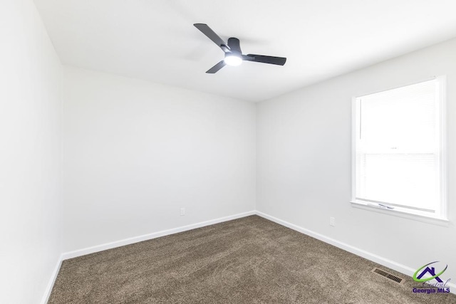 804 Arrowhead Trl, Warner Robins, GA 31088 - unfurnished room with dark carpet and ceiling fan