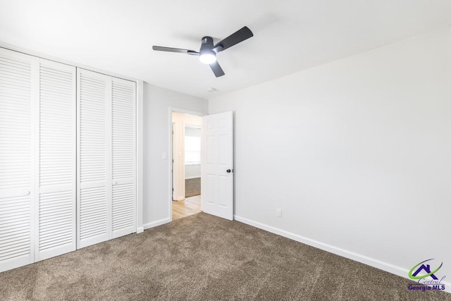 804 Arrowhead Trl, Warner Robins, GA 31088 - unfurnished bedroom featuring carpet, a closet, and a ceiling fan