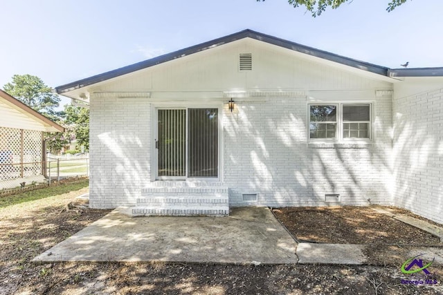 804 Arrowhead Trl, Warner Robins, GA 31088 - rear view of house with entry steps, brick siding, crawl space, and a patio area