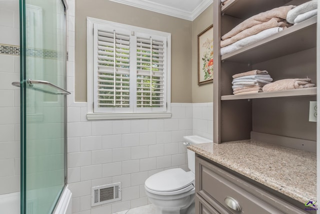 4871 Oxford Rd, Macon, GA 31210 - bathroom with tile walls, crown molding, vanity, wainscoting, and shower / bath combination with glass door