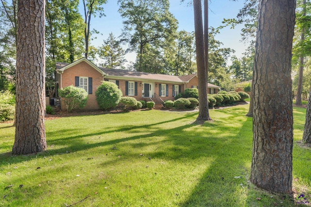 4871 Oxford Rd, Macon, GA 31210 - ranch-style home featuring brick siding and a front lawn