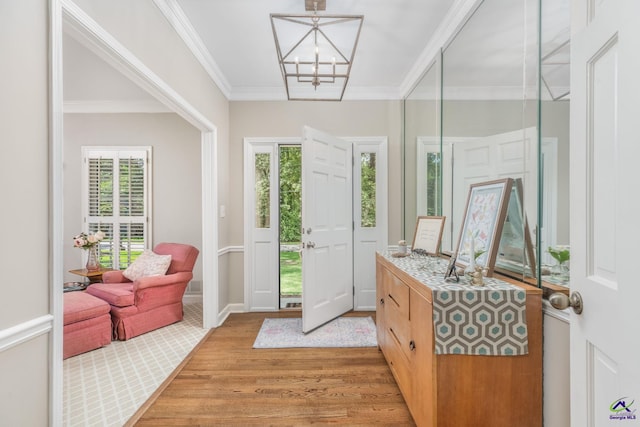 4871 Oxford Rd, Macon, GA 31210 - entrance foyer featuring light wood-style flooring, healthy amount of natural light, a chandelier, and crown molding