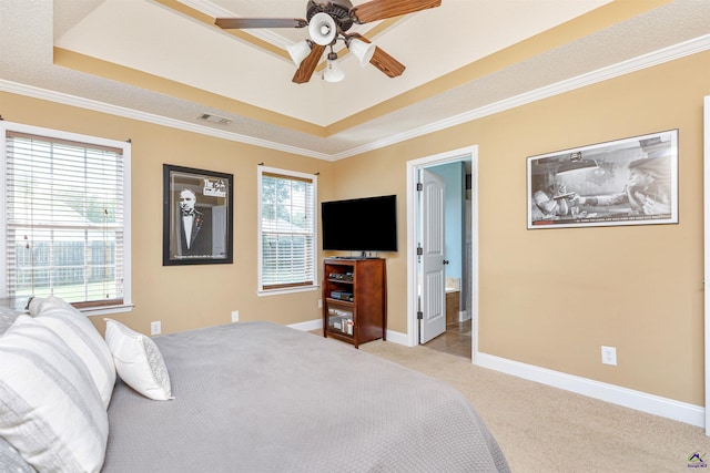 413 Madison Place Parkway, Byron, GA 31008 - bedroom featuring a tray ceiling, light carpet, crown molding, and connected bathroom