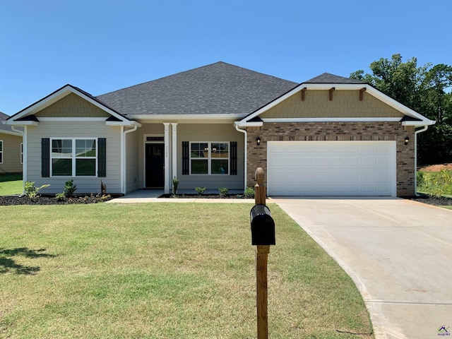 1406 Barrington Place Ter, Macon, GA 31220 - view of front of property featuring an attached garage, driveway, a front lawn, and brick siding