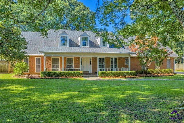 105 International Blvd, Warner Robins, GA 31088 - cape cod house with a porch and brick siding
