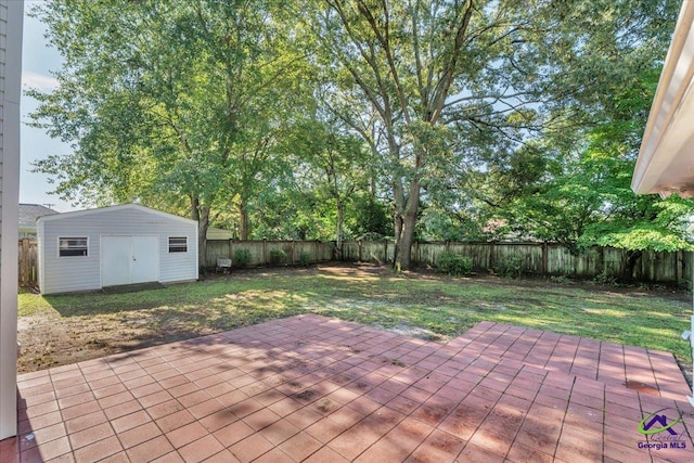 105 International Blvd, Warner Robins, GA 31088 - fenced backyard with a patio and an outbuilding