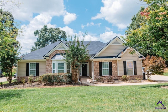 202 Stafford Beach Dr, Byron, GA 31008 - view of front of home featuring brick siding and a front yard