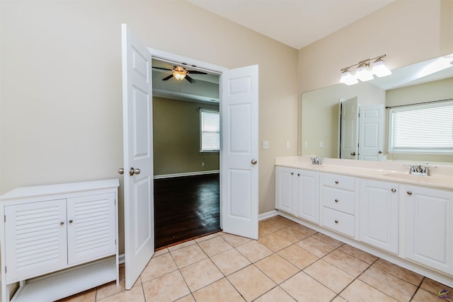 202 Stafford Beach Dr, Byron, GA 31008 - bathroom featuring double vanity, healthy amount of natural light, tile patterned floors, and ceiling fan