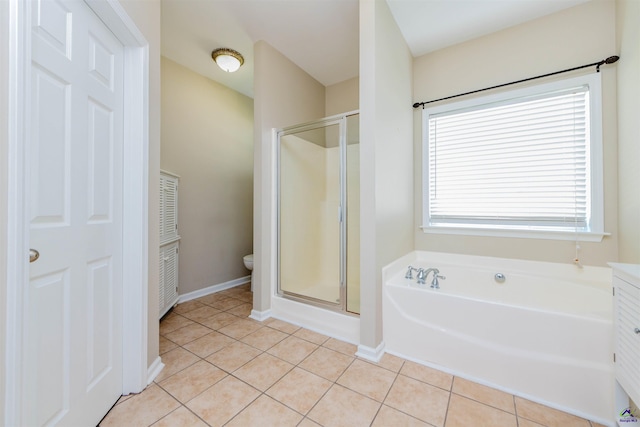 202 Stafford Beach Dr, Byron, GA 31008 - full bath featuring a stall shower, a garden tub, and tile patterned floors