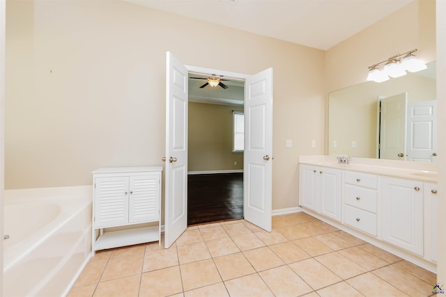 202 Stafford Beach Dr, Byron, GA 31008 - bathroom featuring a bath, double vanity, tile patterned flooring, and a ceiling fan