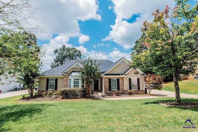 202 Stafford Beach Dr, Byron, GA 31008 - view of front of property featuring brick siding and a front yard
