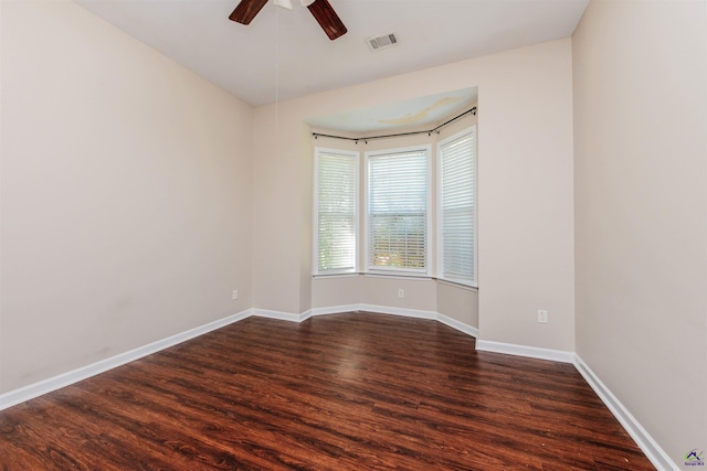202 Stafford Beach Dr, Byron, GA 31008 - empty room with dark wood-style floors and a ceiling fan