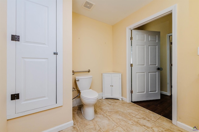 202 Stafford Beach Dr, Byron, GA 31008 - bathroom with toilet and baseboards