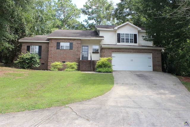 125 Buckskin Trl, Byron, GA 31008 - tri-level home featuring driveway, brick siding, an attached garage, and crawl space