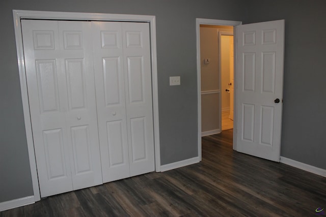 125 Buckskin Trl, Byron, GA 31008 - unfurnished bedroom with a closet and dark wood finished floors