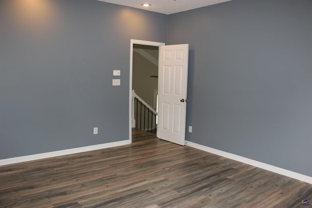 125 Buckskin Trl, Byron, GA 31008 - empty room featuring dark wood-style flooring and recessed lighting