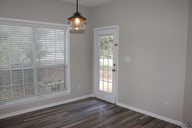 125 Buckskin Trl, Byron, GA 31008 - unfurnished dining area with dark wood-type flooring and baseboards
