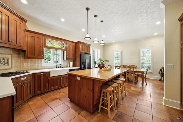 228 Lagrange Ct, Macon, GA 31210 - kitchen featuring black gas cooktop, refrigerator with ice dispenser, plenty of natural light, a center island, and recessed lighting