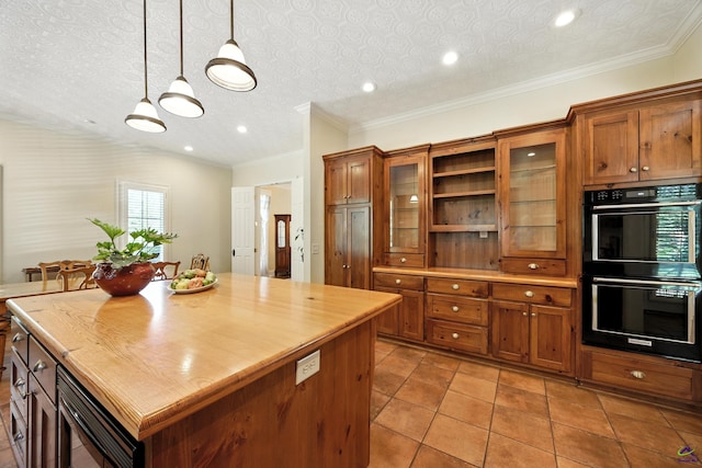 228 Lagrange Ct, Macon, GA 31210 - kitchen with brown cabinets, built in microwave, decorative light fixtures, a center island, and recessed lighting
