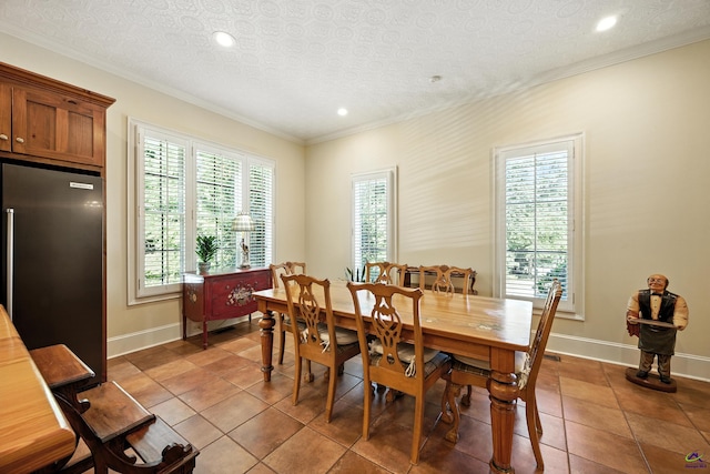 228 Lagrange Ct, Macon, GA 31210 - tiled dining area featuring crown molding, recessed lighting, and a textured ceiling
