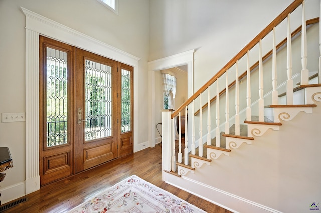 228 Lagrange Ct, Macon, GA 31210 - entryway with plenty of natural light, wood finished floors, stairs, and a high ceiling