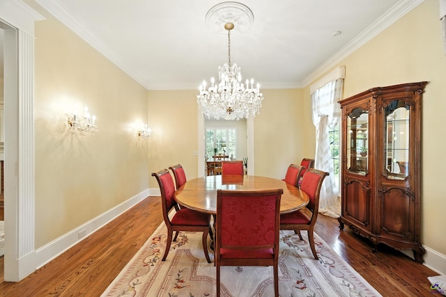 228 Lagrange Ct, Macon, GA 31210 - dining space featuring a chandelier, wood finished floors, and ornamental molding