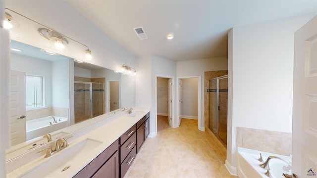 452 Southern Oaks Dr, Macon, GA 31216 - full bath with a shower stall, double vanity, a bath, and a walk in closet