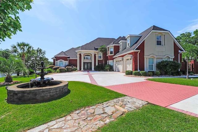 view of front facade featuring a front yard and a garage