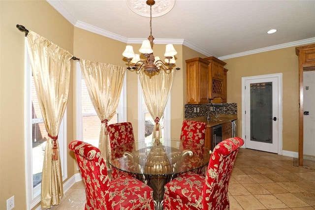 tiled dining room featuring crown molding, wine cooler, and an inviting chandelier