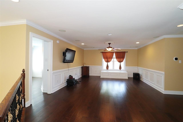 spare room featuring ceiling fan, crown molding, and dark hardwood / wood-style floors