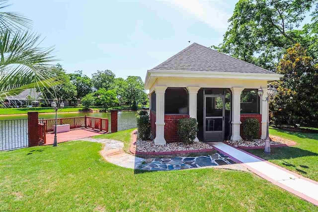 exterior space featuring a lawn and a gazebo