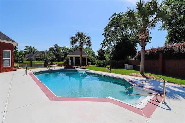 view of swimming pool featuring a lawn and a patio