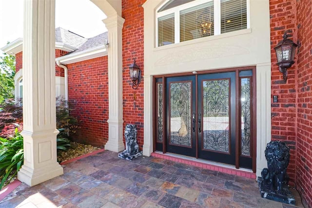 view of exterior entry featuring french doors